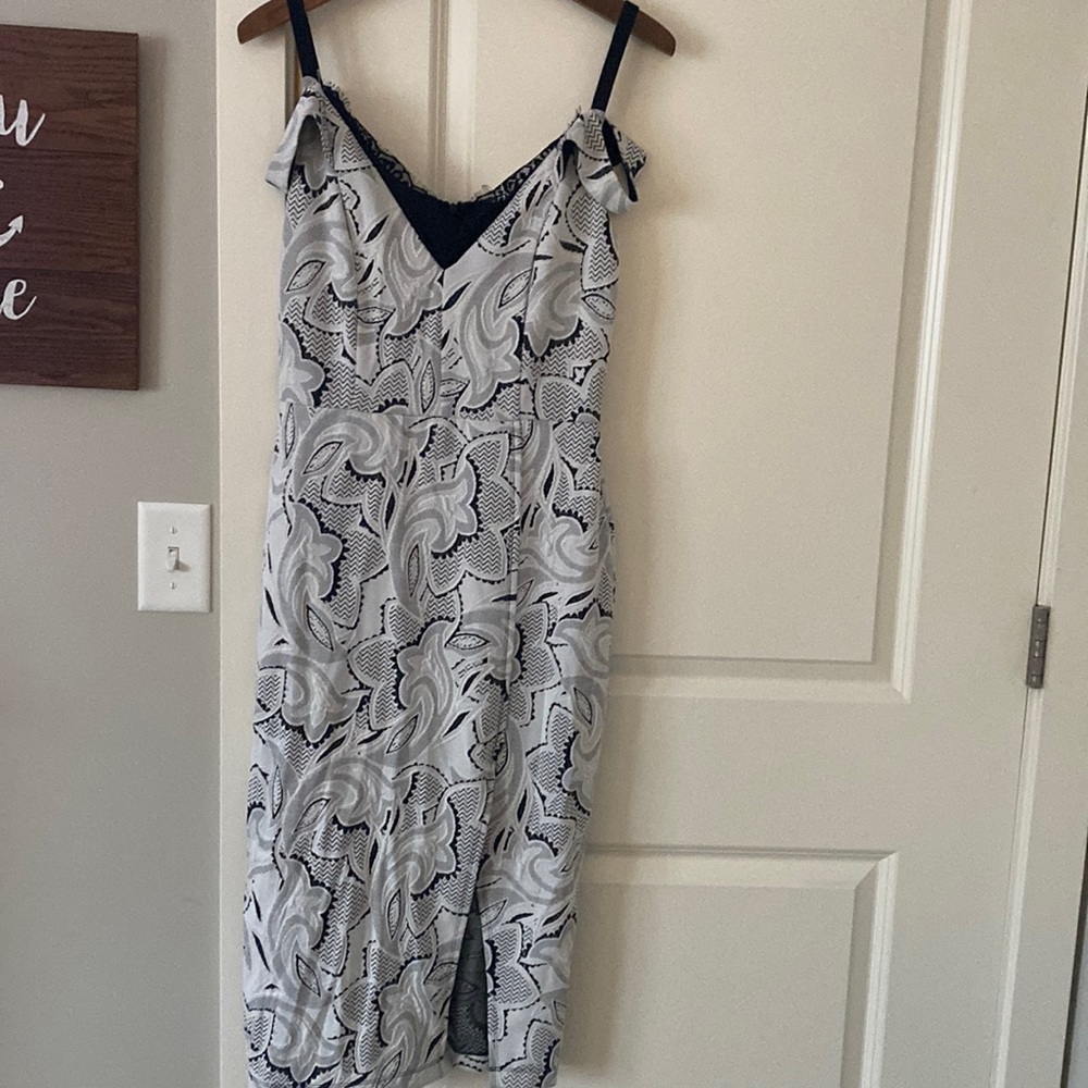 Unique style and pattern. Polyester/spandex, fully lined. Zip up back